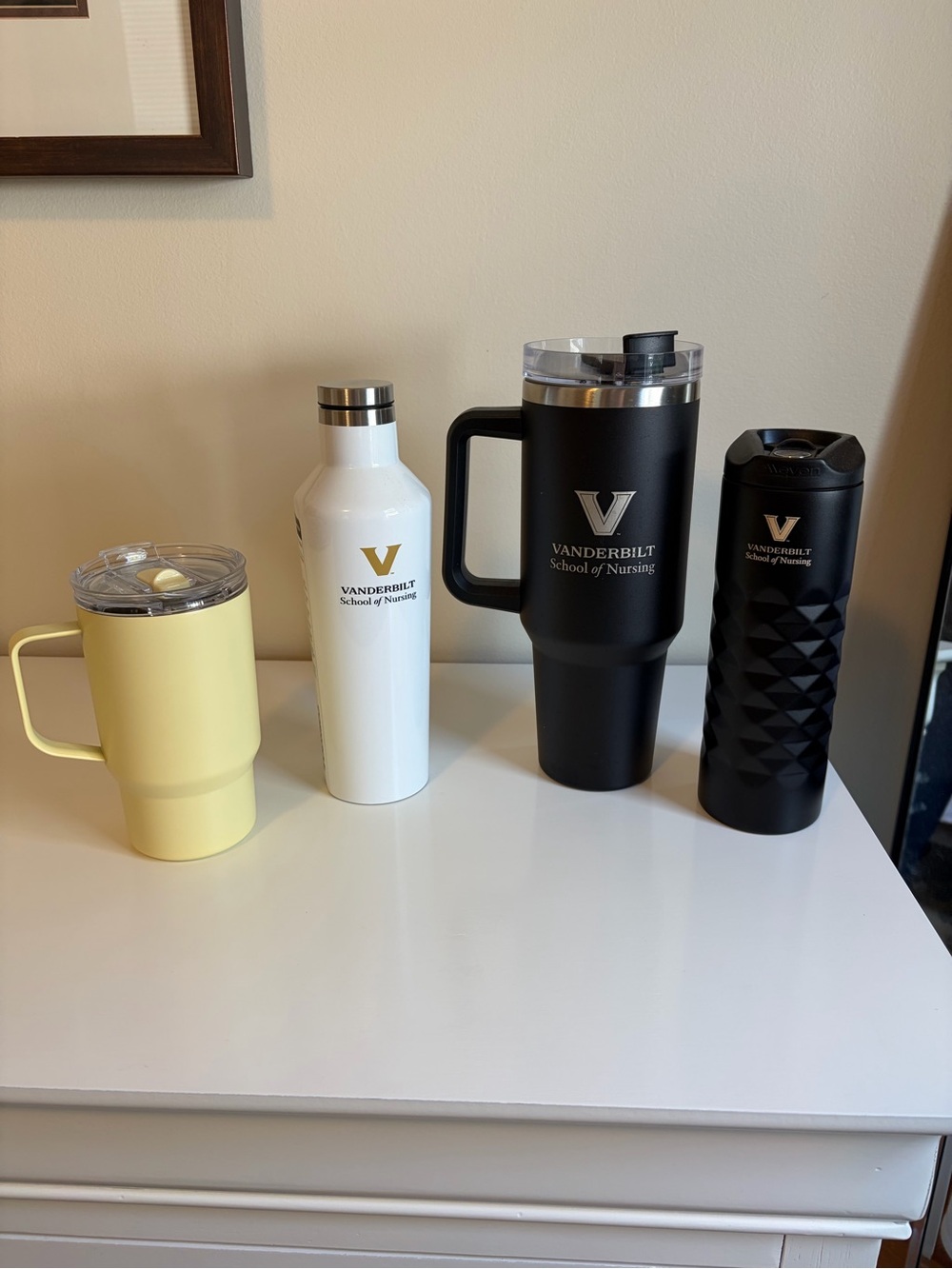 Set of 4 drink containers. Vanderbilt school of Nursing.